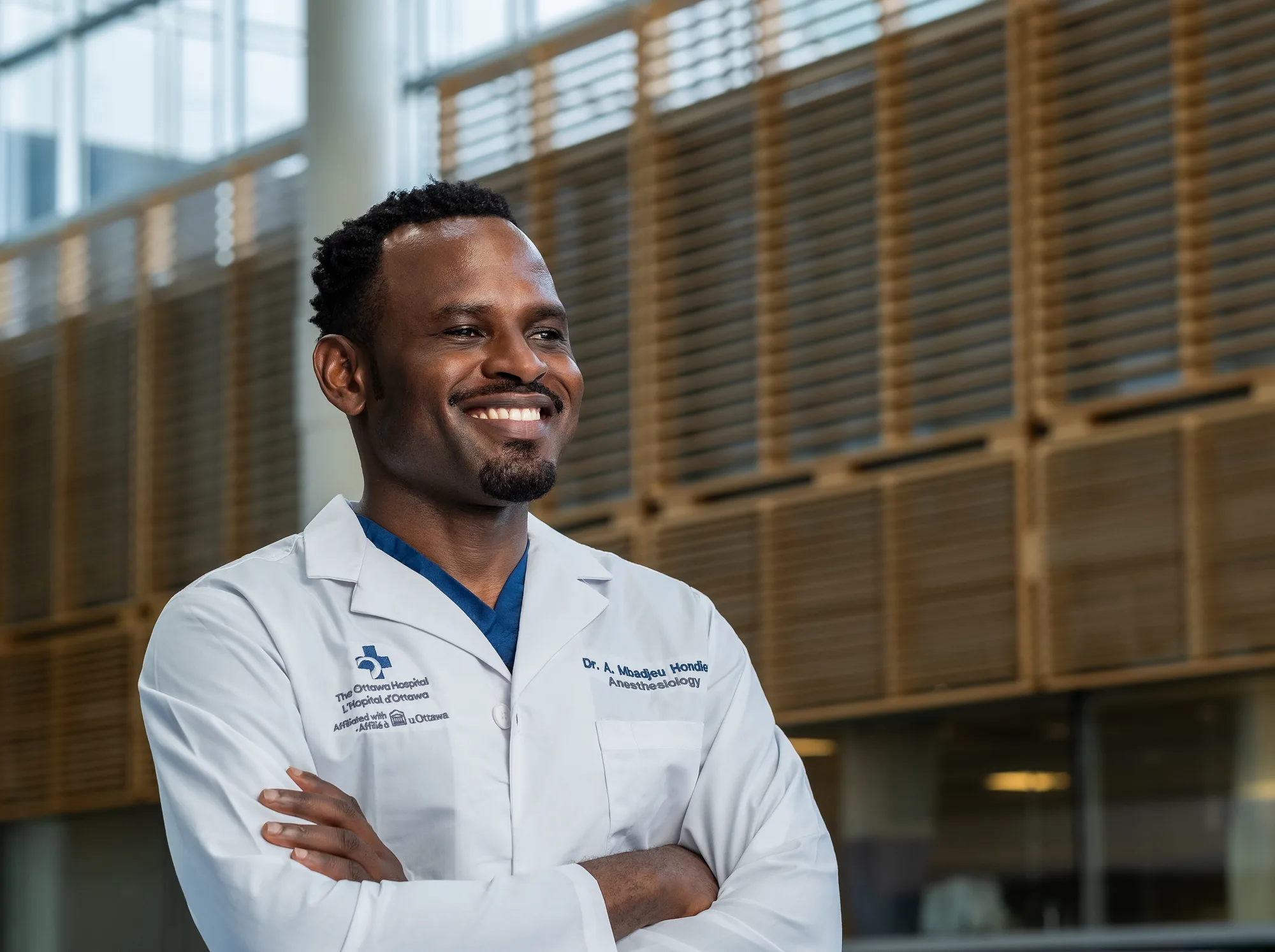 Dr. Arnaud Romeo Mbadjeu Hondjeu in the atrium of The Ottawa Hospital